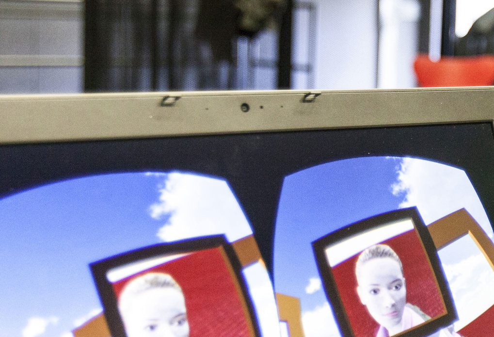Computer screen with VR application, person in the background